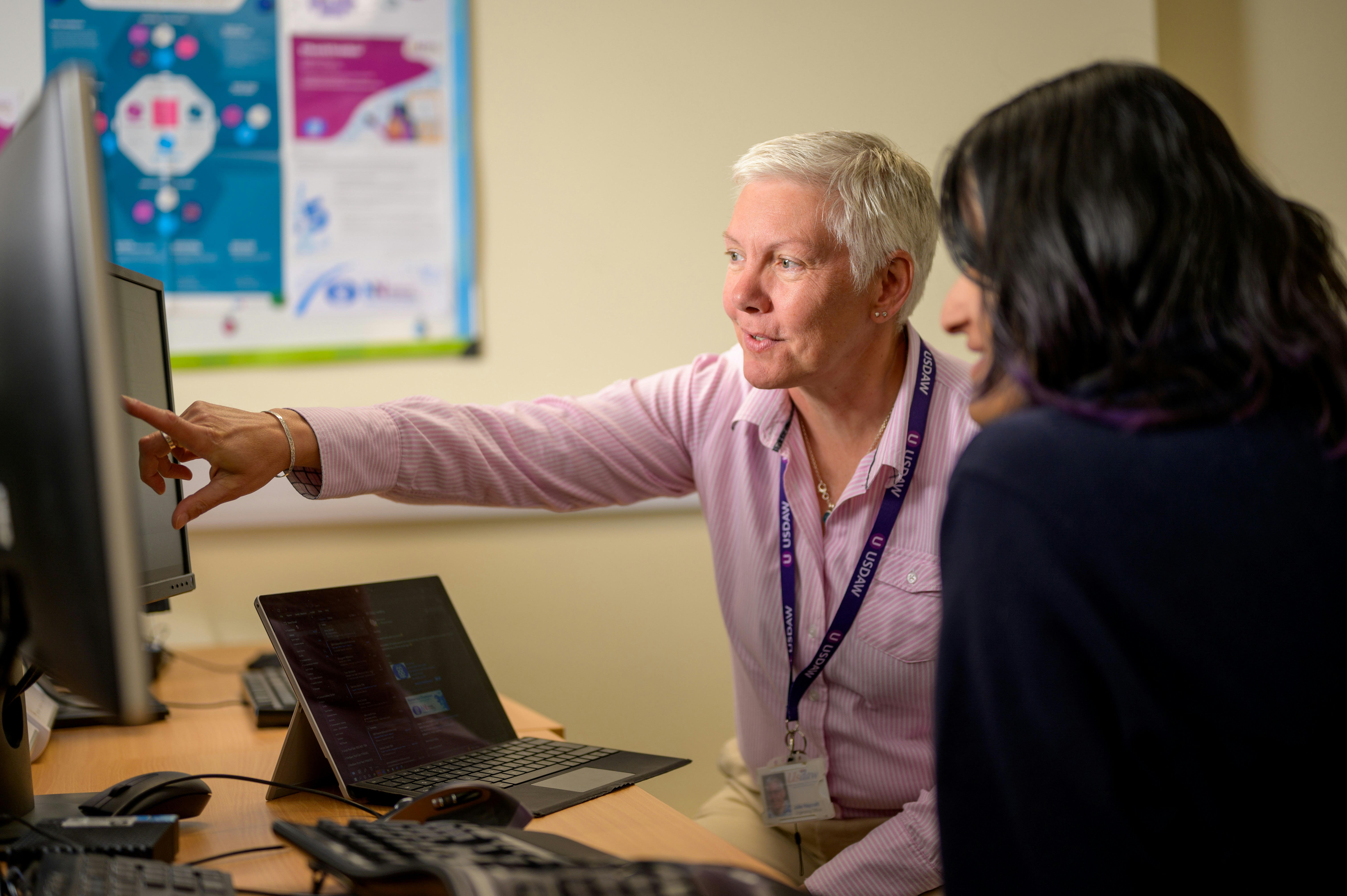 One-on-one coaching at a computer