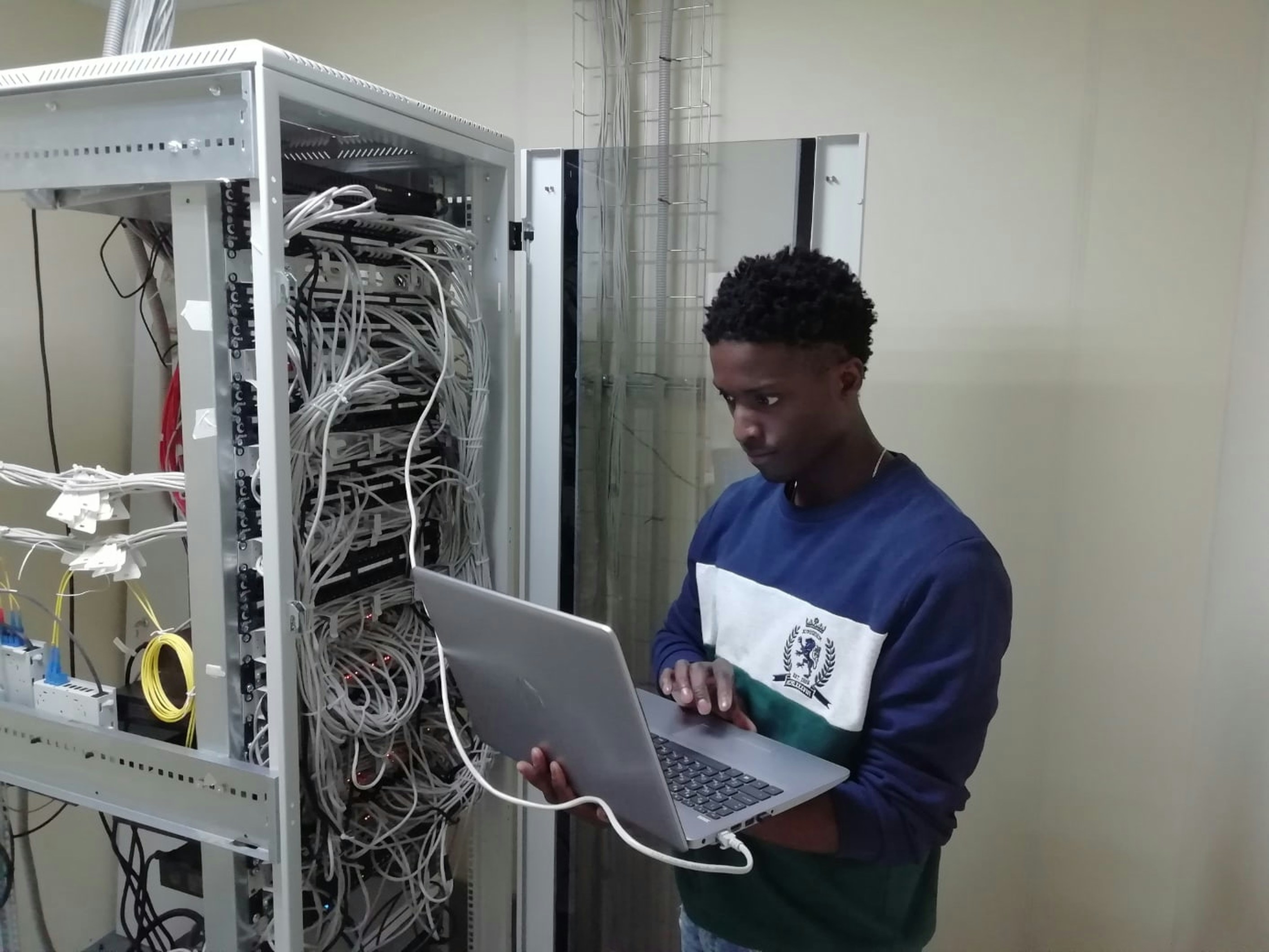Technician managing cabling in a server rack